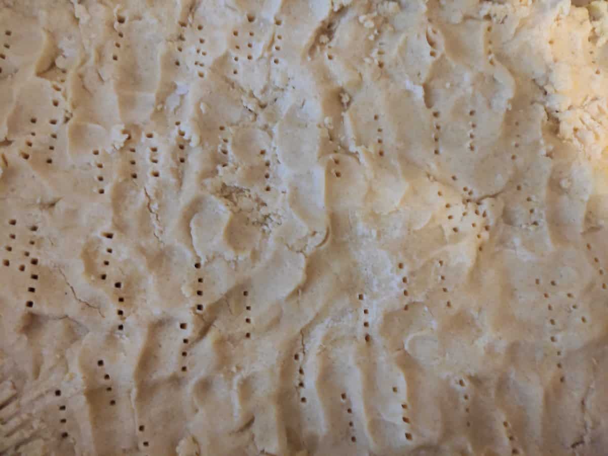 Make holes in the fough with the fork.