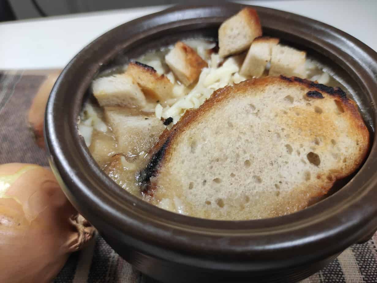 Add croutons and bread as a crust on the soup.