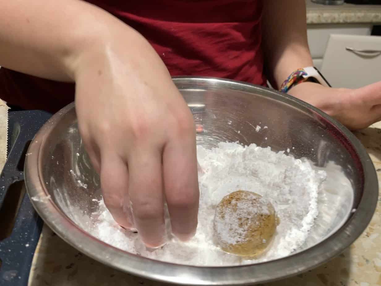 Coat the balls with sugar when they are hot.