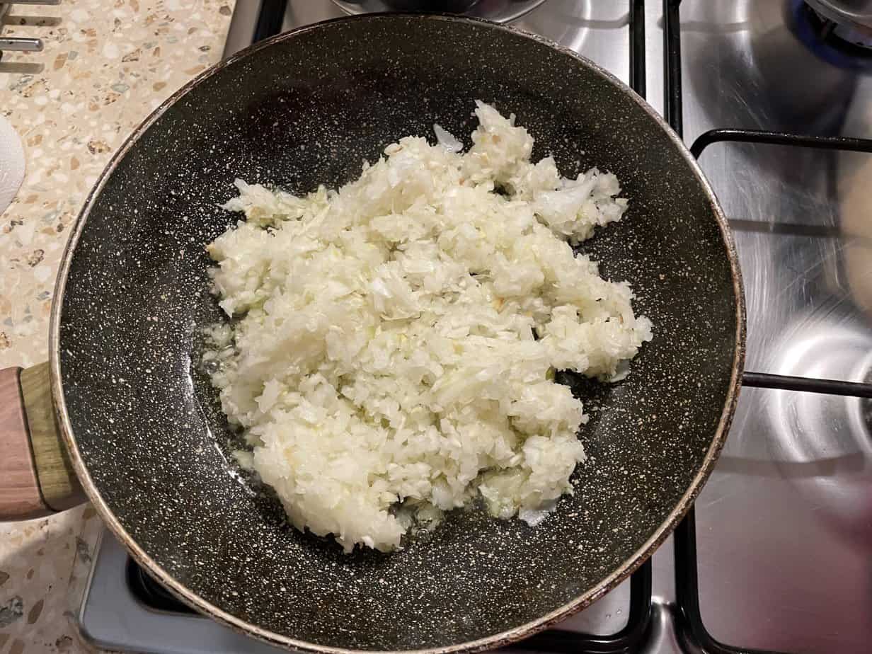 Fry the onions and the crushed garlic.