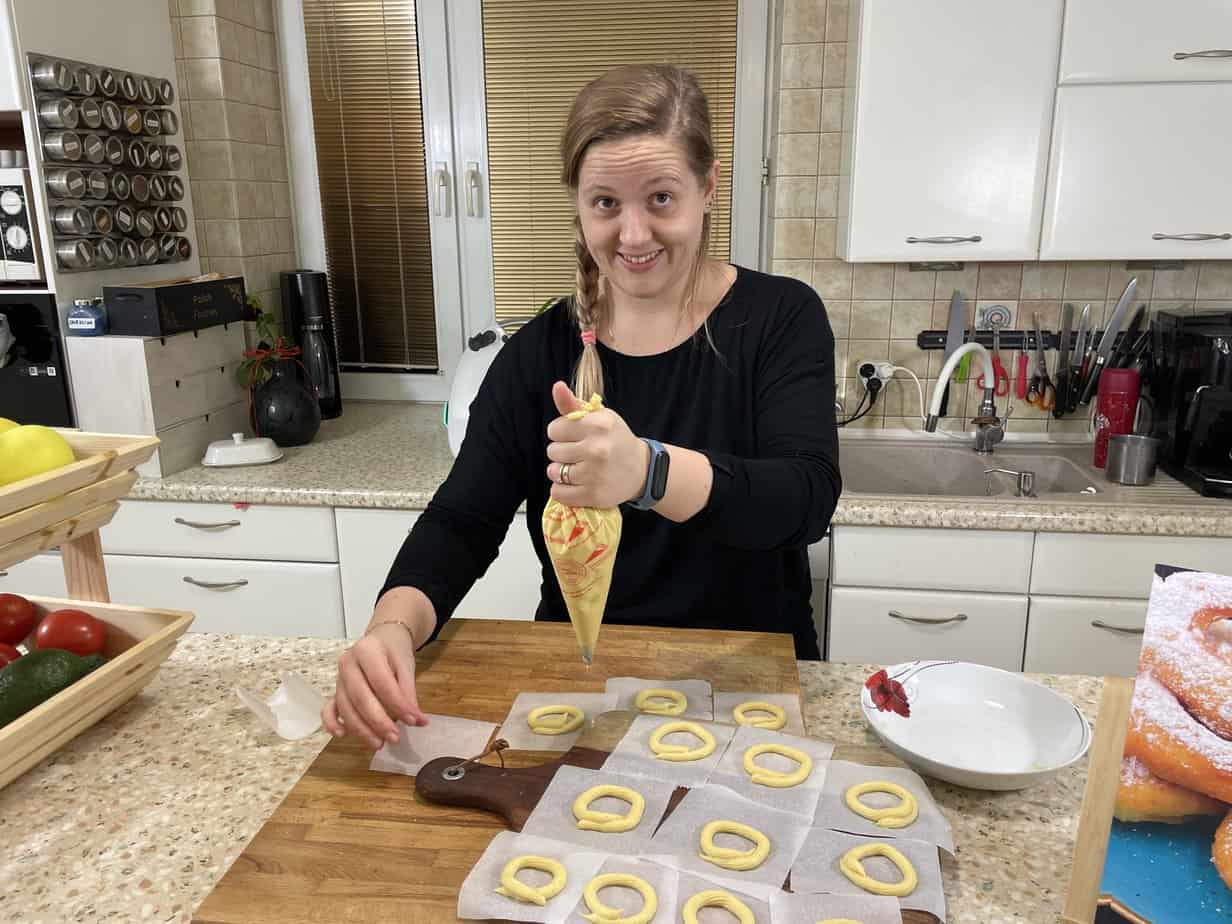 Pipe the Polish nest donut shapes on to the parchment squares.
