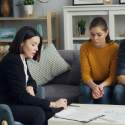 Real estate agent meeting with home buyers during the buying process