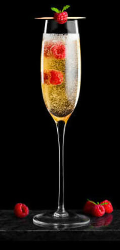 Homemade Champagne and Raspberry Ice Cream Cheers to the New Year image 3 rwo cha,pagne flutes filled with champagne and raspberries on cocktail sticks black background frosted fusions