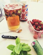 anyone-for-pimms-homemade-pimms-and-lemonade-ice-cream-image-2-large-jug-of-pimms-and-lemonade-with-a-punnet-of-fresh-strawberries-fresh-mint-leaves-and-cucumber-frosted-fusions
