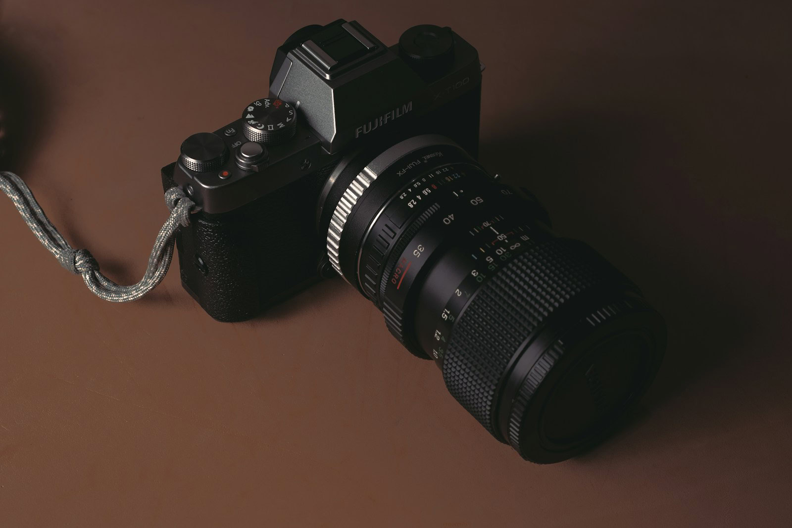 black nikon dslr camera on brown wooden table