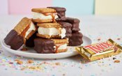 Twix-Ice-Cream-Sandwich-A-Frozen-Twist-On-A-Classic-Chocolate-Bar-Image-4-stack-of-Twix-ice-cream-sandwiches-with-caramel-biscuit-layers-and-half-dipped-in-chocolate-Frosted-Fusions