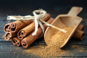 Homemade Cinnamon & Churros Ice Cream Spice and Crispy Comfort image 2 bundle of cinnamon wrapped in string with ground cinnamon in scoop frosted fusions