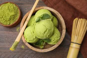 Homemade Matcha Ice Cream Recipe – A Taste Of Japan image 5 top view of a bowl of matcha ice cream with matcha powder off to the side Frosted Fusions