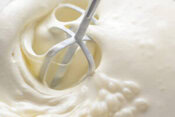 Healthy And Super Easy Homemade Ice Cream Ideas & Recipes image 1 close up of hand mixer whsking milk amd cream for fluffly ice cream base Frosted Fusions