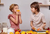 Shirley Temple Sorbet – A Classic Mocktail Summer Dessert image 4 two children in kitchen with fruit Frosted Fusions