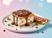 Twix Ice Cream Sandwich A Frozen Twist On A Classic Chocolate Bar Image 2 stacked Twix ice cream sandwiches with caramel biscuit layers and half-dipped in chocolate Frosted Fusions