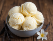 Beyond Vanilla, 13 Unique Ice Cream Flavours To Try This Summer image 4 bowl of vanille ice cream with fresh vanilla pod and flower to the side Frosted Fusions