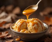 Sugar-and-Spice-and-All-Things-ICE-image-3-spoon-drizzling-warm-salted-caramel-over-scoops-of-creamy-vanilla-ice-cream-Frosted-Fusions