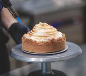 Homemade-Baked-Alaska-Its-the-Bomb-image-6-baked-alaska-being-torched-to-char-the-meringue-frosted-fusions Homemade-Baked-Alaska-Its-the-Bomb-image-6-baked-alaska-being-torched-to-char-the-meringue-frosted-fusions