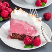 Homemade-Baked-Alaska-Its-the-Bomb-image-5-wedge-of-baked-alaska-showing-the-layers-of-ice-cream-cake-and-charred-meringue-with-fresh-raspbeeries-and-silver-fork-frosted-fusions Homemade-Baked-Alaska-Its-the-Bomb-image-5-wedge-of-baked-alaska-showing-the-layers-of-ice-cream-cake-and-charred-meringue-with-fresh-raspbeeries-and-silver-fork-frosted-fusions