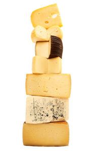 Homemade-Cheese-and-Pickle-Ice-Cream-An-Unconventional-Flavour-Fusion-image-5-a-selection-of-cheeses-stacked-frosted-fusions