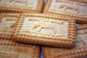 Homemade Malted Milk Ice Cream – Creamy, Crunchy, And Delicious image 3 pile of malted milk biscuits showing cow in design Frosted Fusions
