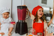Naturally Sweet Sorbets For Summer – Healthy, Easy Dessert Ideas image 6 two kids with chefs whites and hats on and fruit in a blender Frosted Fusions