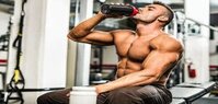 protein-shake-fusions-creating-protein-rich-low-fat-homemade-ice-cream-image-3-man-in-gym-gear-amongst-gym-equipment-downing-a-protein-shake-frosted-fusions