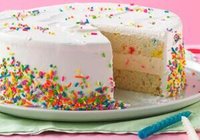 homemade-birthday-cake-ice-cream-recipe-image-3-birthday-ice-cream-cake-with-piece-cut-out-showing-the-layers-of-cake-and-ice-cream-frosted-fusions