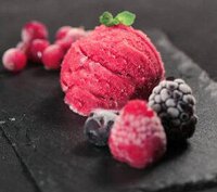 move-over-mr-musk-ice-cream-is-the-next-big-thing-image-2-scoop-of-berry-ice-cream-on-black-slate-with-fresh-berries-and-fresh-leaves-frosted-fusions