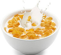a-homemade-crunchy-cornflake-ice-cream-recipe-image-2-white-bowl-of-cornflakes-with-milk-splashing-white-background-frosted-fusions