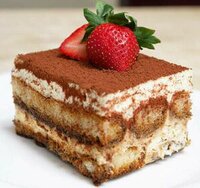 indulge-your-senses-with-a-decadent-tiramisu-ice-cream-recipe-image-1-piece-of-classic-tiramisu-cake-with-fresh-strawberries-on-top-frosted-fusions