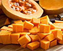 autumnal-perfection-homemade-pumpkin-ice-cream-recipe-image-3-slice-of-pumpkin-with-seeds-and-pumpkin-chunks-frosted-fusions