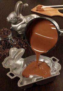 easter-eggs-travaganza-homemade-easter-egg-ice-cream-ideas-image-8-melted-chocolate-being-poured-into-easter-bunny-mould-frosted-fusions