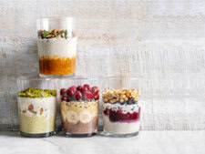 Quick-Easy-And-Deliciously-Healthy-Breakfast-Smoothie-Recipes-image-2-four-smoothie-glasses-filled-with-a-selection-of-different-breakfast-smoothies-and-ingredients-Frosted-Fusions