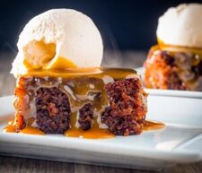 how-to-pair-ice-cream-with-classic-christmas-desserts-image-2-slice-of-sticky-toffee-pudding-with-scoop-of-ice-cream-drizzled-with-caramel-sauce-frosted-fusions