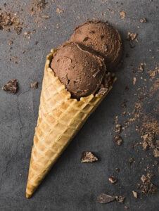 Gelato vs Ice Cream: Isnt it the same thing? Image 4 jpeg Choc ice cream 2 scoops and cone with chocolate shavings black background frosted fusions