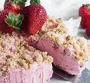 Homemade Strawberry Cheesecake Ice Cream Recipe image 3 strawberry cheesecake ice cream with fresh strawberries and crumbled biscuits frosted fusions