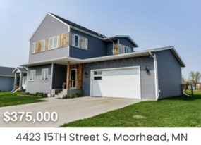Two-story gray siding home with wood accents and attached garage under a clear sky, overlaid with the price &lsquo;$375,000&rsquo; and the address &lsquo;4423 15TH Street S, Moorhead, MN