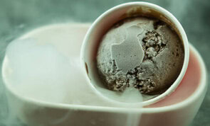 How Long Does Homemade Ice Cream Last In Your Freezer image 4 scoop of ice cream in bowl showing signs of freezer burn frosted fusions