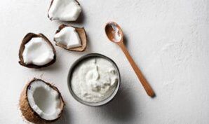 Vegan-And-Non-Dairy-Homemade-Ice-Cream-Using-Coconut-Milk-featured-image-612x364-half-coconuts-showing-coconut-flesh-with-bowl-of-coconut-milk-and-wooden-spoon-frosted-fusions
