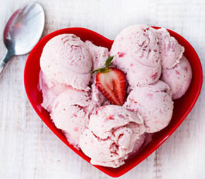 How Long Does Homemade Ice Cream Last In Your Freezer image 3 heart shaped red dish with strawberry ice cream and a fresh sliced strawberry with silver spoon frosted fusions