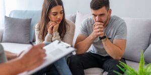 married couple seems struggling with their marriage, talking to a therapist
