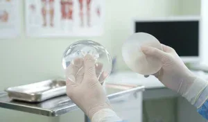surgeon demonstrating texture difference silicone vs saline implants