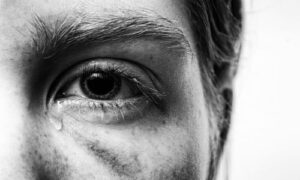 an eye of a woman experience trauma