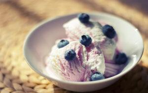 What's the most popular ice cream flavour image 4 jpeg rippled ice cream in white bowl with fresh blueberries frosted fusions