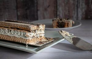 Learn-How-To-Make-A-Homemade-Viennetta-Ice-Cream-Dessert-image-9-chocolate-and-cream-layered-viennetta-with-sliced-portion-frosted-fusions