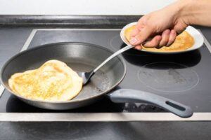Mastering-the-Art-Make-Homemade-Ice-Cream-Cones-image-7-waffles-being-made-in-frying-pan-frosted-fusions