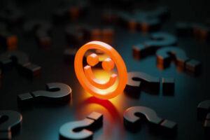 The-Ninja-Creami-A-Detailed-Review-image-8-smiley-neon-orange-emoji-with-numerous-question-marks-scattered-frosted-fusions
