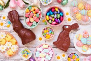 easter-eggs-travaganza-homemade-easter-egg-ice-cream-ideas-image-2-chocolate-easter-bunnies-with-a-selection-of-sweeties-in-bowls-and-scattered-frosted-fusions