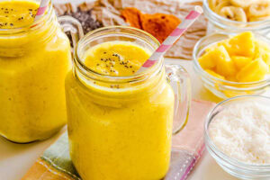 What-Smoothie-Is-Best-For-The-Immune-System-image-4-trpoical-mango-and-pineapple-smoothie-with-turneric-in-dish-and-chia-seeds-Frosted-Fusions