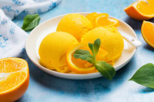 No-Leap-Just-A-Scoop-Ice-Cream-Flavours-To-Spring-Into-March-image-5-Lemon-and-orange-sorbet-with-fresh-green-leaves-Frosted-fusions
