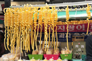 The-Coolest-Ice-Cream-Styles-From-Around-The-World-image-10-Jipangyi-from-South-Korea-lined-up-and-hanging-from-food-stall-Frosted-Fusions