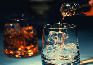 Homemade Ice Cream Hacks You Need To Know image 5 tumbler of ice with alcohol being poured another filled tumbler in the background frosted fusions