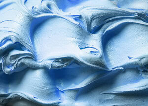 Mastering Homemade Gelato - A Beginner’s Guide To Italy’s Sweetest Tradition image 3 close up of a tray of light blue gelato showing waves of creamy gelato frosted fusions